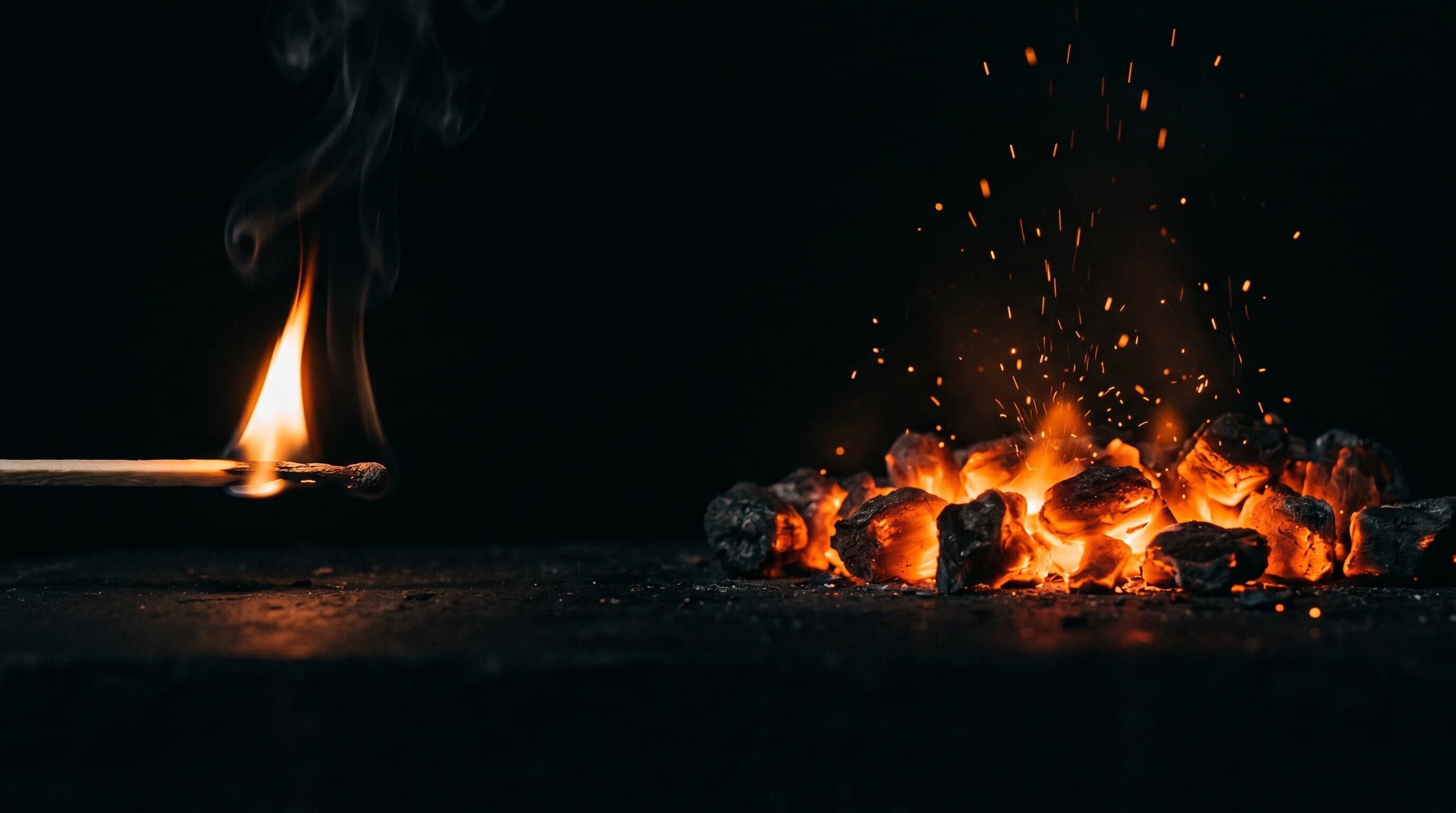 A struck match burning briefly next to a steady forge of orange embers, illustrating one-time payments versus compounding monthly revenue