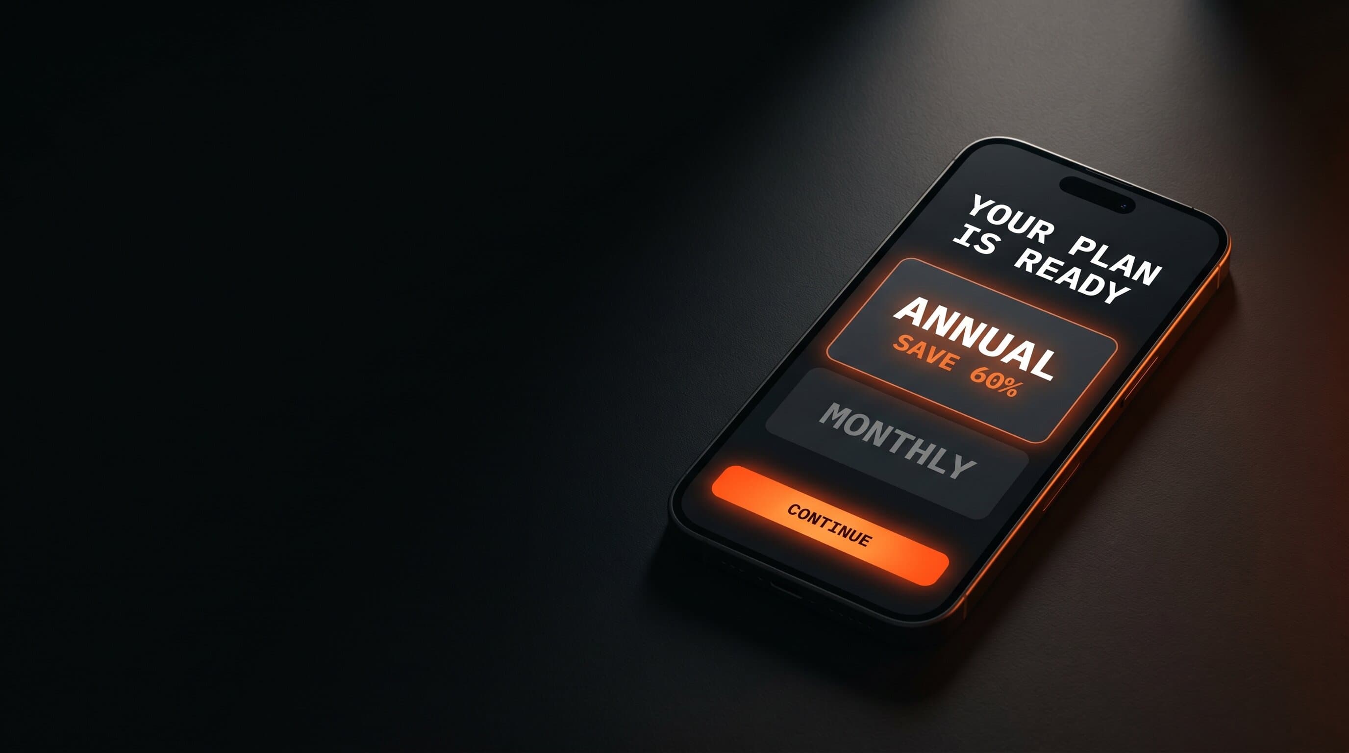 Phone showing a creator app paywall with annual and monthly options against a dark studio background