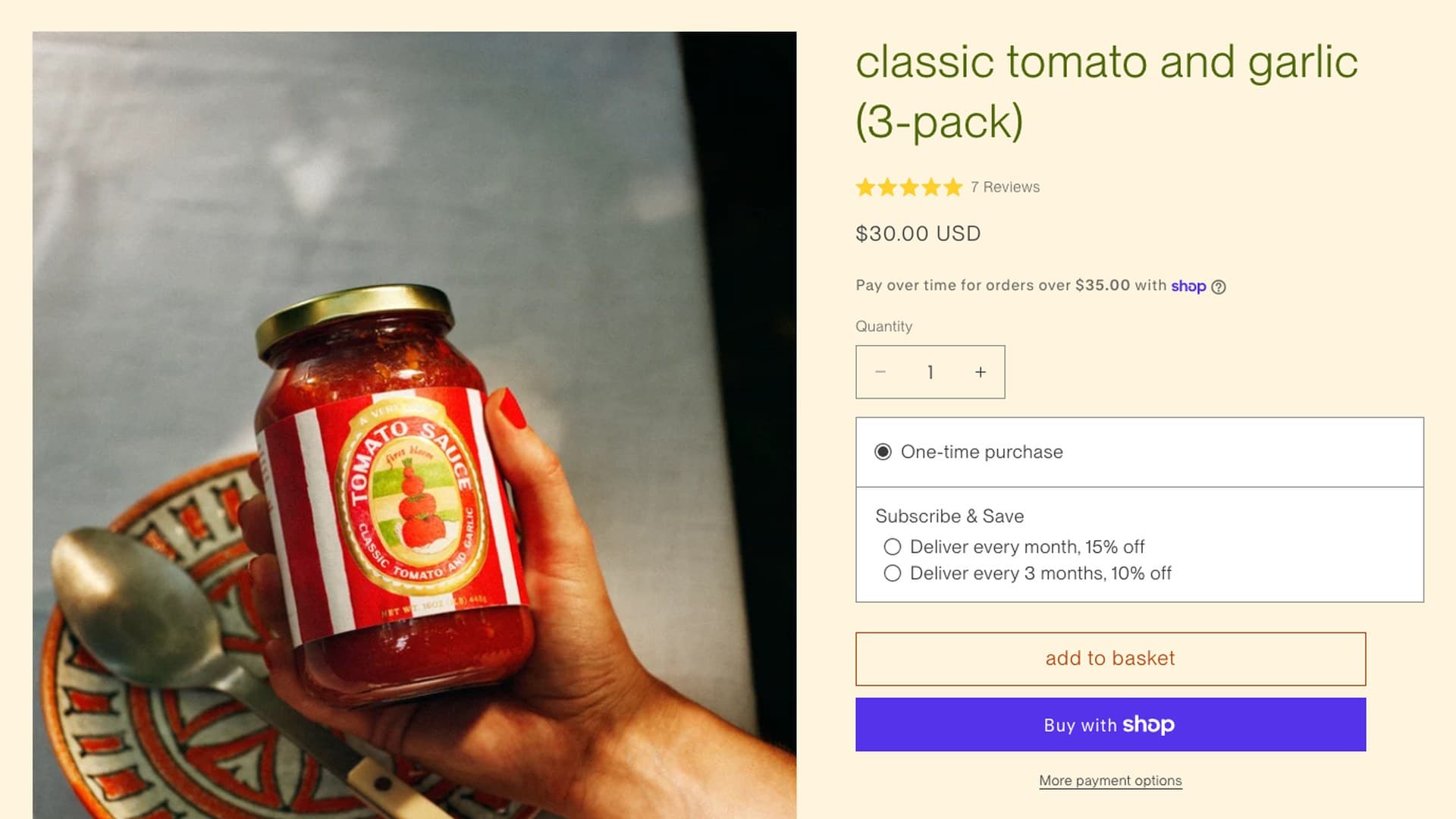 The First Bloom product page for classic tomato and garlic (3-pack): a hand holding a jar of tomato sauce over a patterned plate, next to a $30.00 USD price, 7 reviews, and a Subscribe & Save box offering Deliver every month, 15% off and Deliver every 3 months, 10% off.