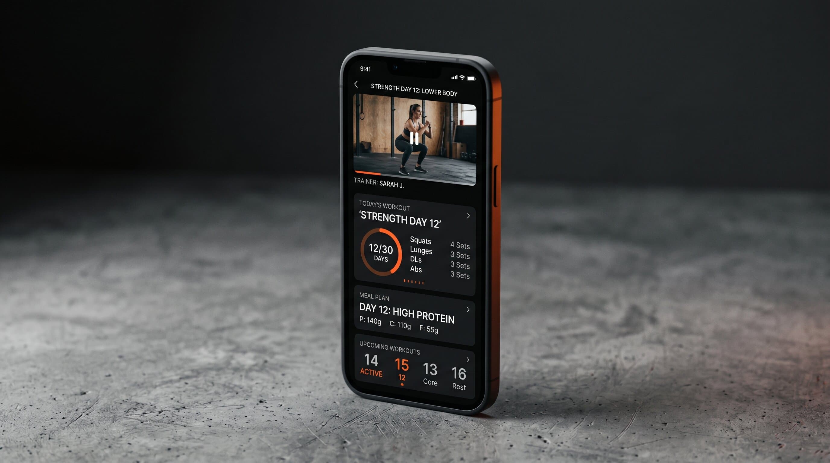 Phone mockup of a Jillian Michaels style fitness subscription app with workout video and progress tracking
