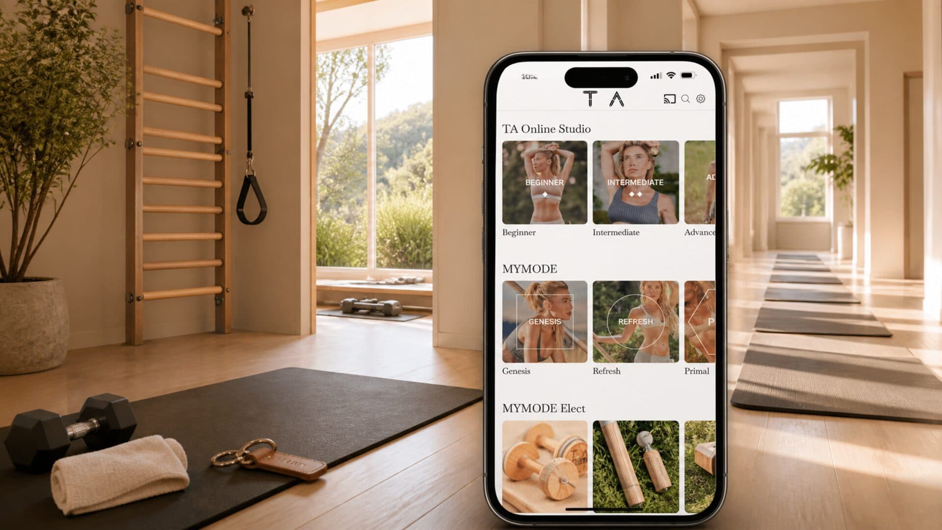 One private training station beside the Tracy Anderson Online Studio app, with empty home workout spaces extending behind it